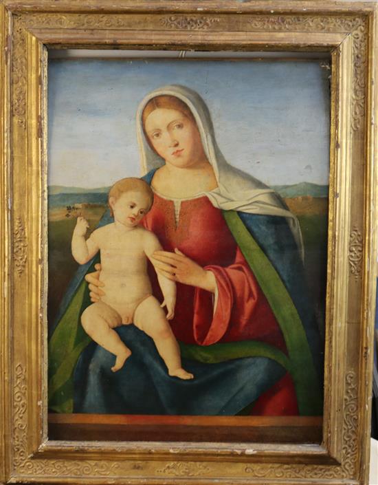 Circle of Francia (Francesco di Marco Raibolini) (1450-1517) Madonna and Child with a landscape beyond 27.5 x 18.5in.